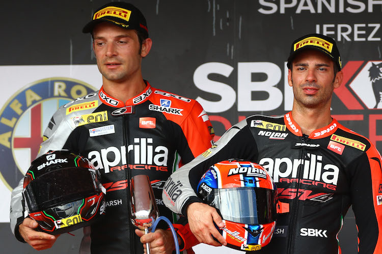 Sylvain Guintoli und Marco Melandri (v.l.) wirken nicht wie ein Team auf dem Podium