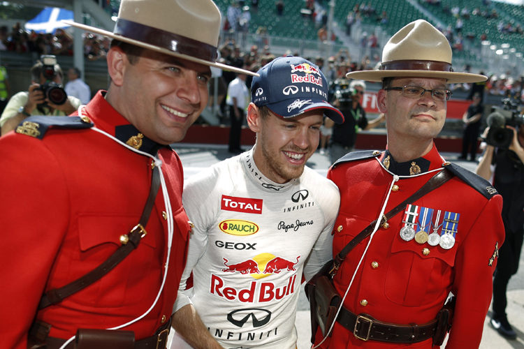 Sebastian Vettel und zwei vom Militär
