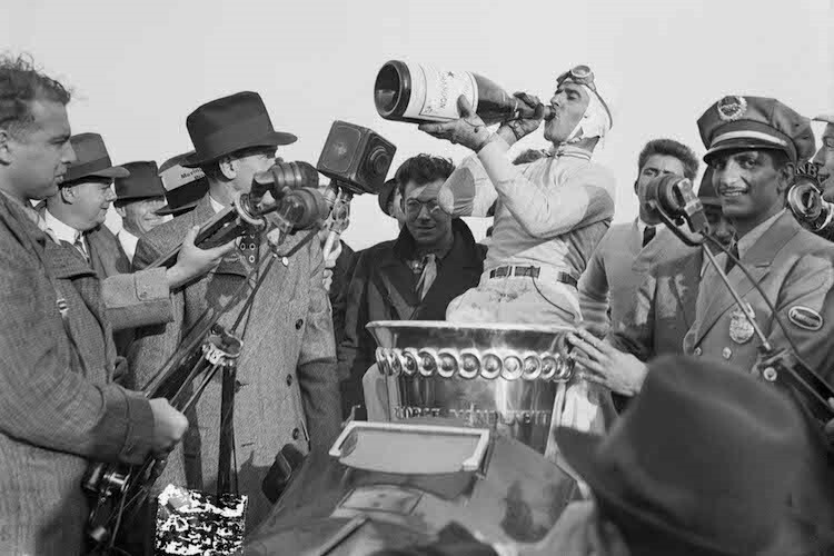 Er war der Erste: Tazio Nuvolari 1936 in den USA mit einer Flasche von Moët & Chandon 