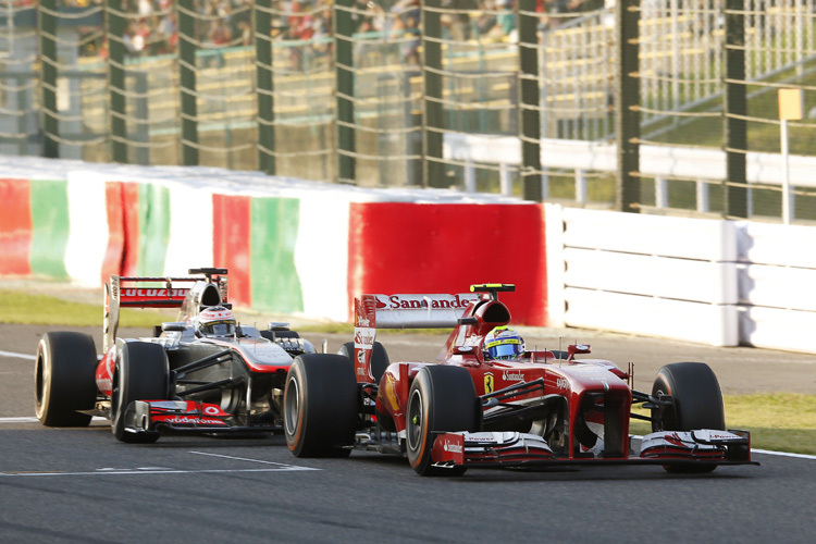 Gleich schnappt sich Jenson Button den Ferrari von Felipe Massa