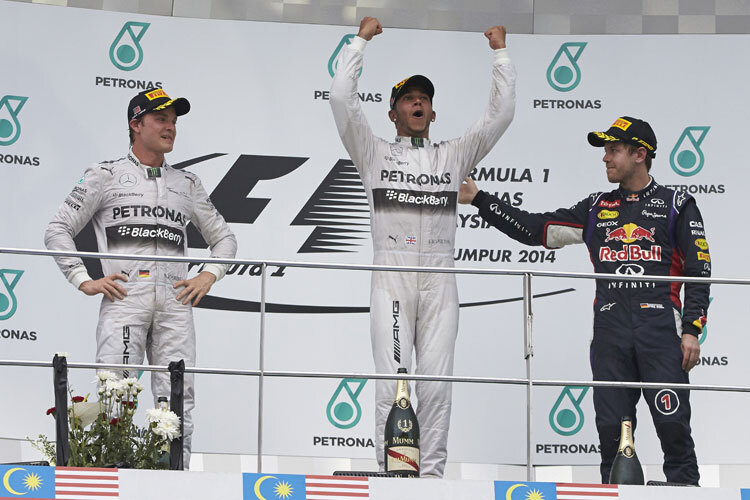 2014 stand Sebastian Vettel - damals in RBR-Diensten - neben Hamilton und Rosberg auf dem Podium