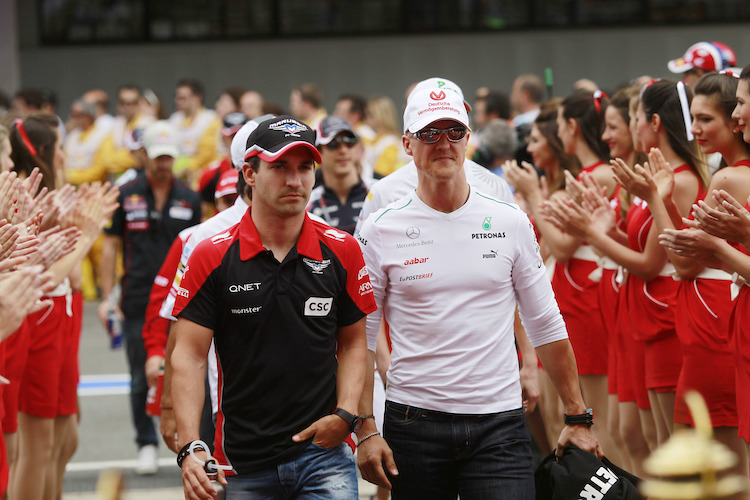 Timo Glock 2012 mit Michael Schumacher