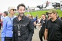 Keanu Reeves mit Begleitung in der Startaufstellung zum Sachsening-GP