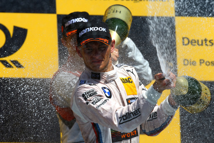 Verdiente Champagner-Dusche: Marco Wittmann sicherte sich beim Saisonauftakt der DTM den Sieg