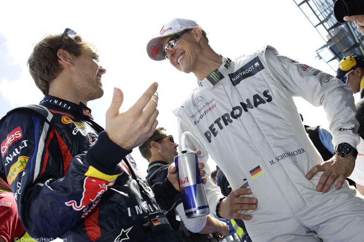 Sebastian Vettel 2012 mit Michael Schumacher