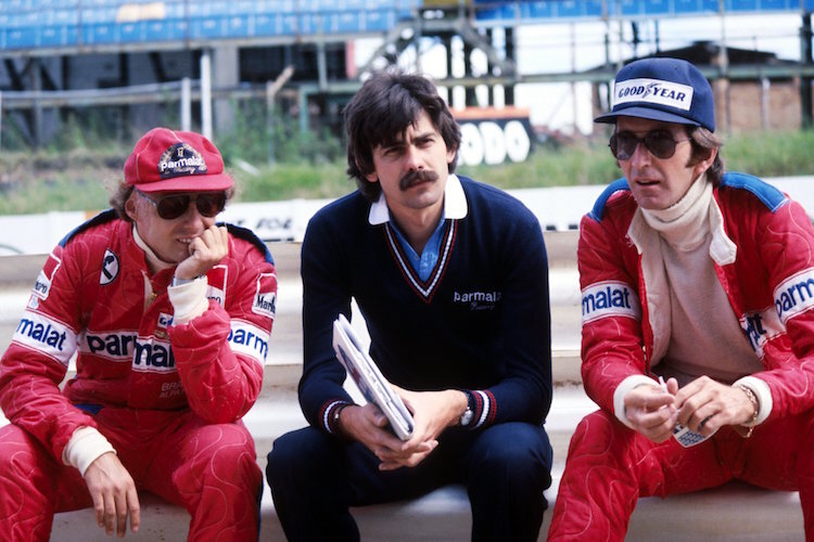 Chefdesigner Gordon Murray mit seinen Fahrern Niki Lauda und John Watson
