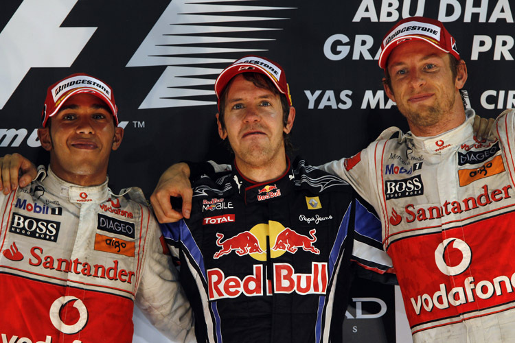 Hamilton und Button (re.) mit Champion Vettel