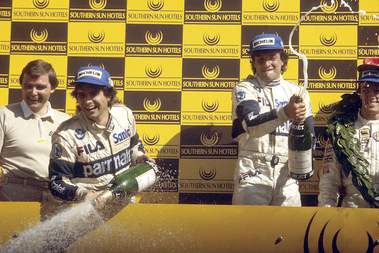 Nelson Piquet feiert in Kyalami 1983 den WM-Titel, Riccardo Patrese rechts den GP-Sieg