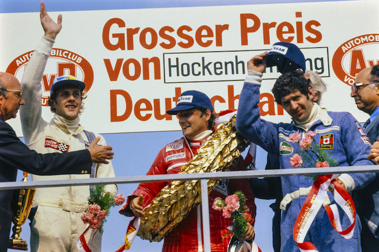 Hans-Joachim Stuck, Niki Lauda und Jody Scheckter 1977 nach dem Grossen Preis von Deutschland auf dem Hockenheimring